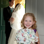 Picture of Flower girl, Bride and Groom at the door Picture